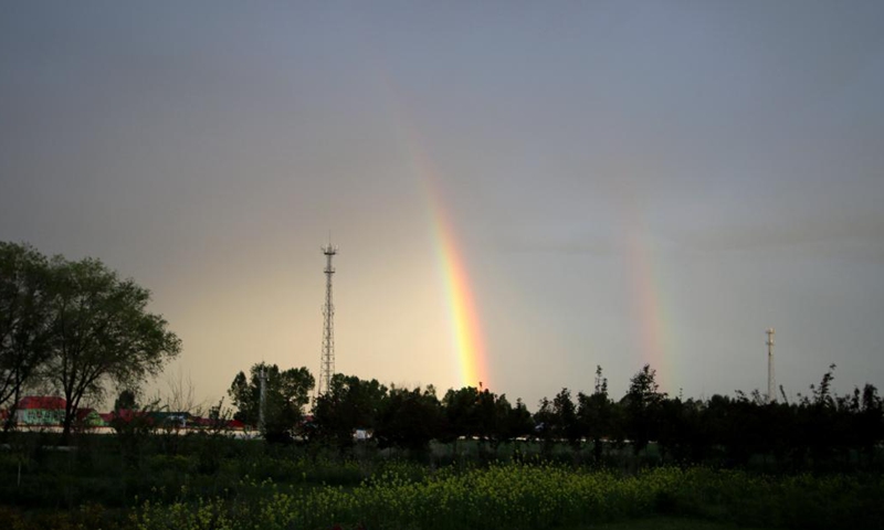 Photo taken on June 14, 2018 shows a double rainbow in Zhaosu County, northwest China's Xinjiang Uygur Autonomous Region. (Photo by Wang Yuan/Xinhua)