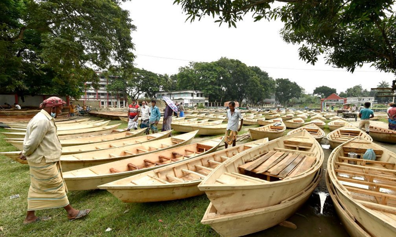 Hand-made wooden boats are displayed for sale at an open-air marketplace in Manikganj district, some 63 km northwest of capital Dhaka, Bangladesh, Aug. 4, 2021. Water transportation is still an important means of communication in some parts of Bangladesh especially during the monsoon season from June to September when sales of traditional small boat increase at the time.Photo:Xinhua