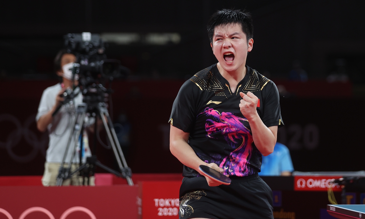 Fan Zhendong celebrates a point at the Tokyo Olympic Games on Friday. Photo: Cui Meng/Global Times