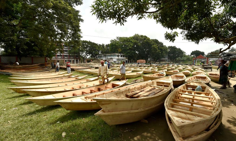 Hand-made wooden boats are displayed for sale at an open-air marketplace in Manikganj district, some 63 km northwest of capital Dhaka, Bangladesh, Aug. 4, 2021. Water transportation is still an important means of communication in some parts of Bangladesh especially during the monsoon season from June to September when sales of traditional small boat increase at the time.Photo:Xinhua