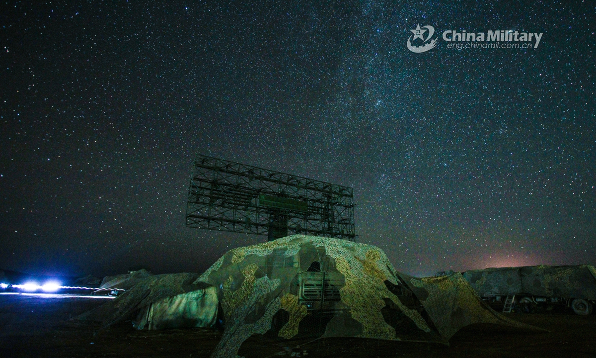 A vehicle-mounted radar station attached to a missile battalion of an air-defense brigade under the PLA 72nd Group Army provides surveillance under the concealment of camouflages at night during a recent round-the-clock air-defense training exercise in northwest China’s Gobi desert.Photo:China Military