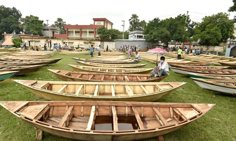 Hand-made wooden boats are displayed for sale at an open-air marketplace in Manikganj district, some 63 km northwest of capital Dhaka, Bangladesh, Aug. 4, 2021. Water transportation is still an important means of communication in some parts of Bangladesh especially during the monsoon season from June to September when sales of traditional small boat increase at the time.Photo:Xinhua