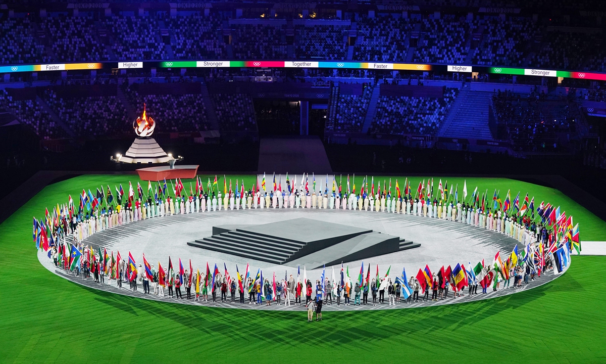 Flag-bearers of all countries' sports delegations who participated in the Tokyo Olympics 2020 enter the National Stadium in Tokyo, Japan during the closing ceremony of the Games on Sunday. Photo: Xinhua