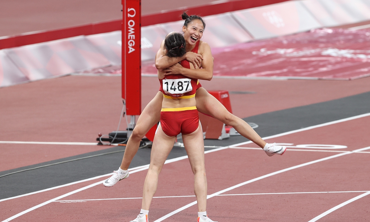 Chinese runners react after the women's 4x100 meters final on Friday. Photo: Cui Meng/Global Times