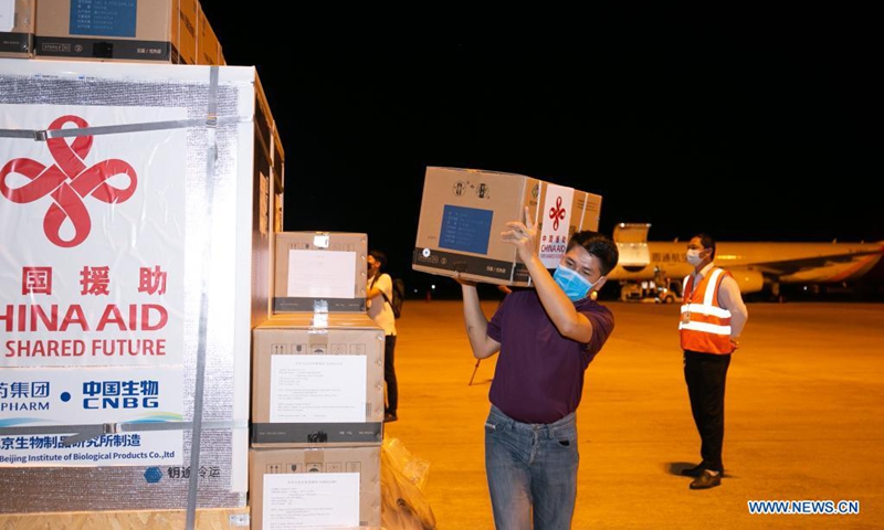 A batch of China-donated Sinopharm COVID-19 vaccines arrives at Wattay International Airport in Vientiane, Laos, Aug. 7, 2021. The fifth batch of China-donated Sinopharm COVID-19 vaccine carried by the Chinese YTO Airlines cargo plane arrived at the Lao capital Vientiane late on Saturday. Lao Health Minister Bounfeng Phoummalaysith and Economic and Commercial Counselor of Chinese Embassy in Laos Zhao Wenyu received the donation at the airport. (Photo by Kaikeo Saiyasane/Xinhua)

