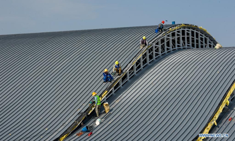Workers work at the construction site for the expansion project of Kashgar International Airport in Kashgar, northwest China's Xinjiang Uygur Autonomous Region, Aug. 7, 2021. The expansion project of Kashgar International Airport is expected to be completed by the end of the year.(Photo: Xinhua)