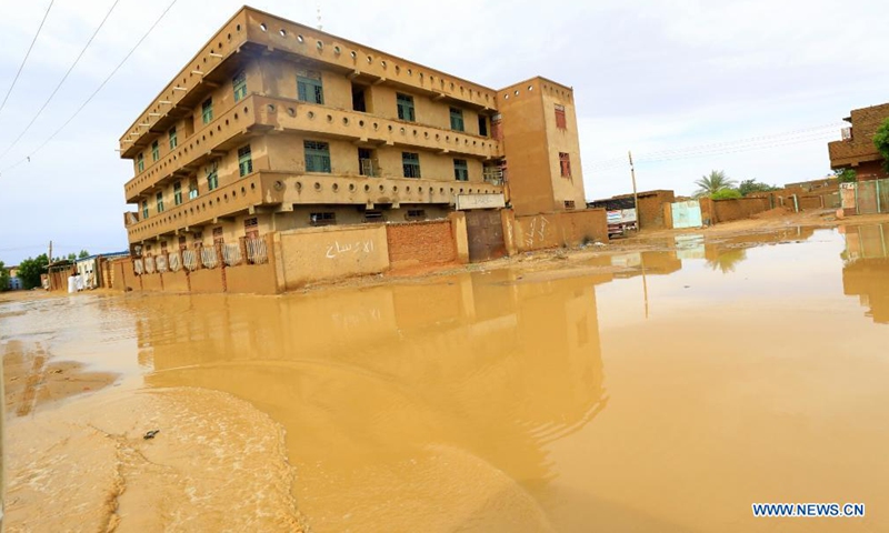 A building is seen flooded after heavy rain hit Khartoum, Sudan, Aug. 8, 2021. (Photo by Mohamed Khidir/Xinhua)