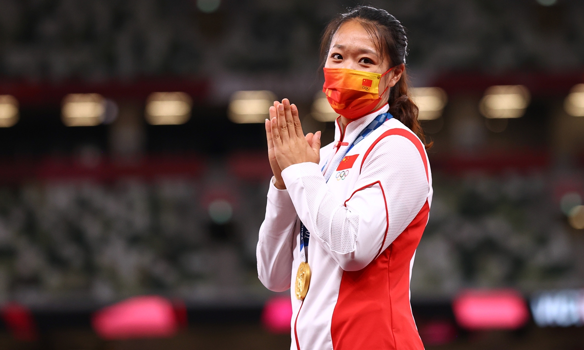 Women's javelin gold medalist Liu Shiying reacts on the podium on Saturday. Photo: IC