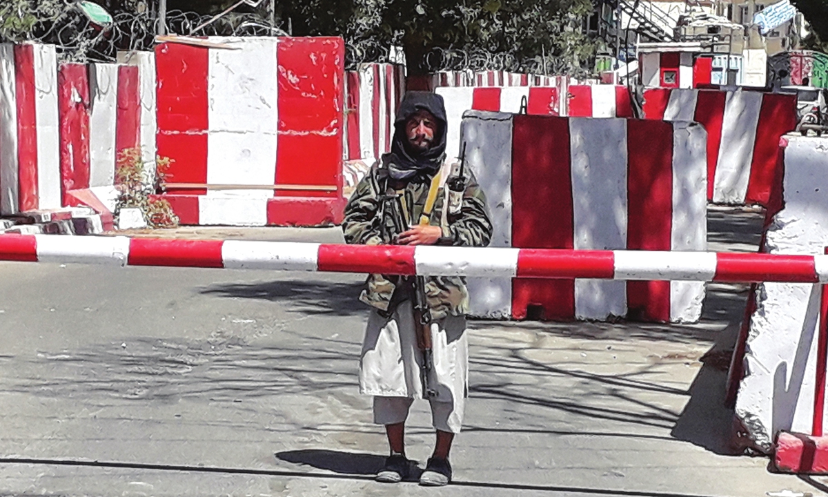 A Taliban fighter stands at the entrance of the police headquarters in Ghazni, Afghan on Thursday, as Taliban move closer to Kabul, Afghan capital, after taking Ghazni.  Photo: AFP