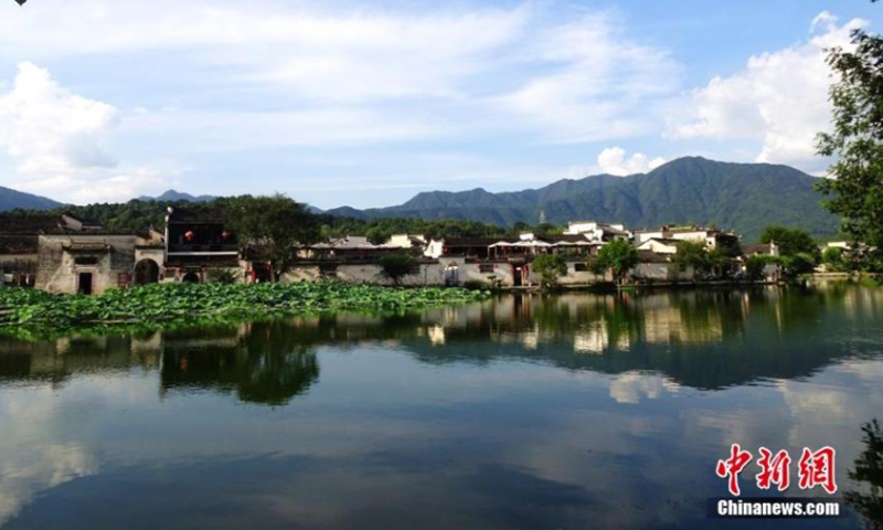 A poetic scenery is seen in the Hongcun Village, Huangshan City in Anhui Province, August 8, 2021. The charming view of the village has attracted students and artists from Hefei (the capital of Anhui Province) and other places to come for sketching. The village was designated as the world heritage site by UNESCO in 2000. (Photo/ Wu Shouyi)
