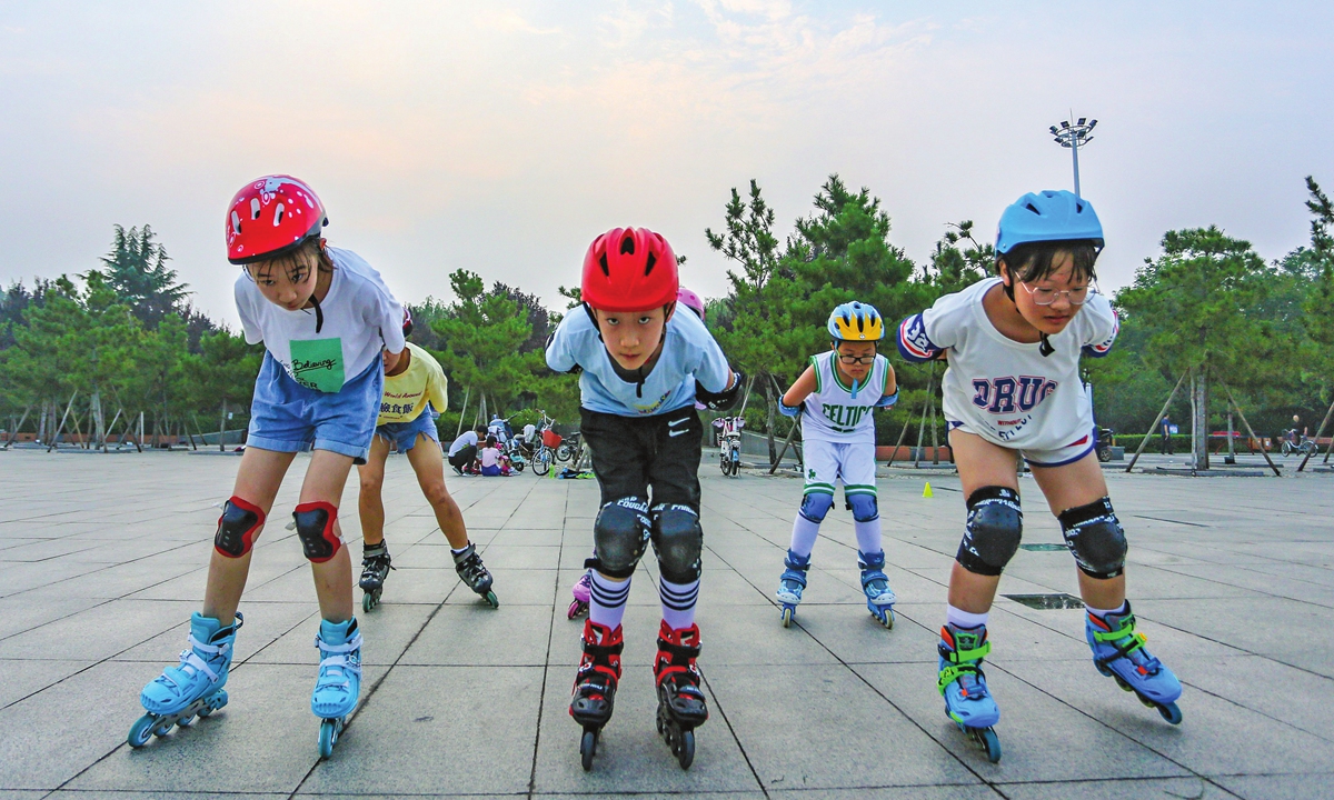 Children roller skate during an activity in Jize county, North China's Hebei Province to celebrate national fitness day on Saturday. Photo: IC