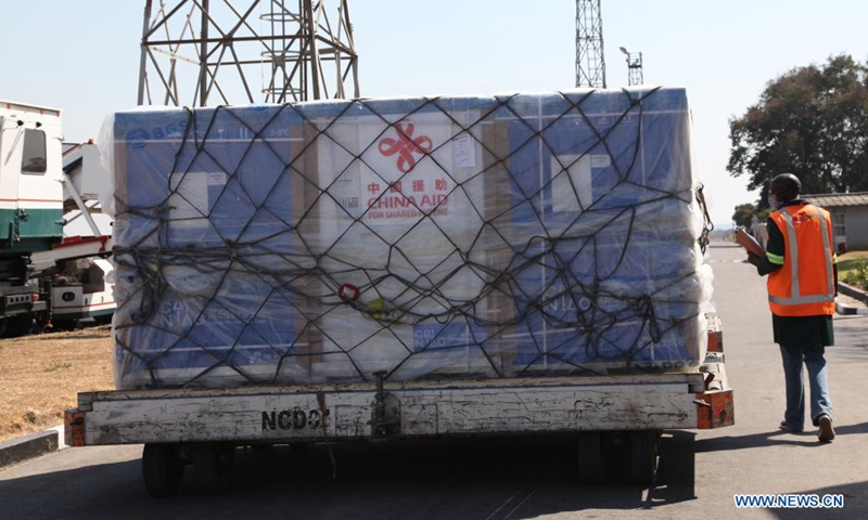 A worker transfers a batch of China's Sinopharm vaccines at the Kenneth Kaunda International Airport in Lusaka, Zambia, on Aug. 7, 2021. A batch of China's Sinopharm vaccines arrived in Zambia on Saturday to be part of the southern African nation's basket of COVID-19 vaccines.(Photo: Xinhua)