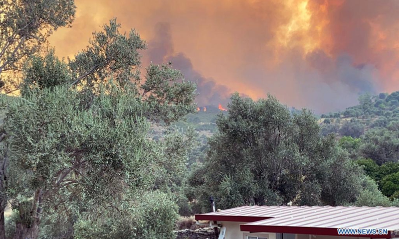 A wildfire is seen near Koycegiz, Mugla province, southwestern Turkey, on Aug. 8, 2021. Turkey has been battling massive wildfires that erupted in southern and southwestern coastal resort towns 12 days ago. Most of them have been taken under control, according to municipal authorities.(Photo: Xinhua)