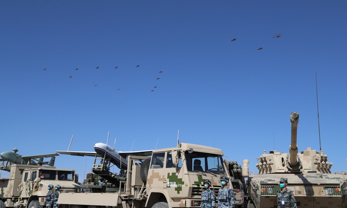 The exercise ZAPAD/INTERACTION-2021 kicks off at a combined arms tactical training base of the PLA Army in Qingtongxia City of West China's Ningxia Hui Autonomous Region on August 9, 2021. Pictures show that the participating troops from China and Russia parade at the launch ceremony in 13 ground phalanxes, together with two air echelons. (eng.chinamil.com.cn/Photo by Liu Fang)
