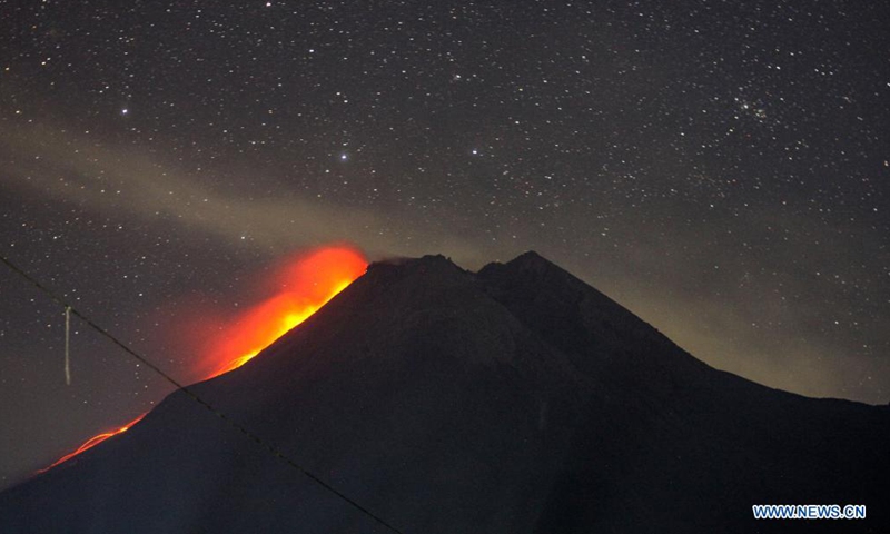 Photo taken on Aug. 10, 2021 shows Mount Merapi spewing volcanic materials as seen at Cangkringan in Sleman district, Yogyakarta, Indonesia. (Photo by Priyo Utomo/Xinhua)