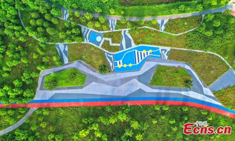 Yuliangzhou, an economic development zone in the central of Xiangyang City, is planted with lawn and green trees, Xiangyang, Hubei Province, August 10, 2021. (Photo/ Yang Dong) 

Xiangyang has launched several ecological restoration projects in recent years, which improves the ecosystem in Yuliangzhou. It is now served as a multifunction zone for residents to enjoy vacations, have short-term travel, or hold athletic activities.
