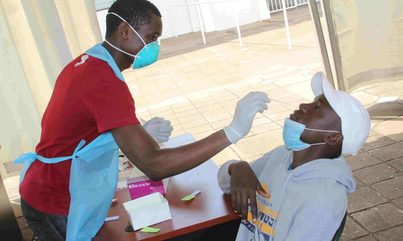 A sports participant (R) gets tested for the COVID-19 virus before being allowed to the event's venue at Moi International Sports Centre in Nairobi, capital of Kenya, on July 2, 2021.(Photo: Xinhua)