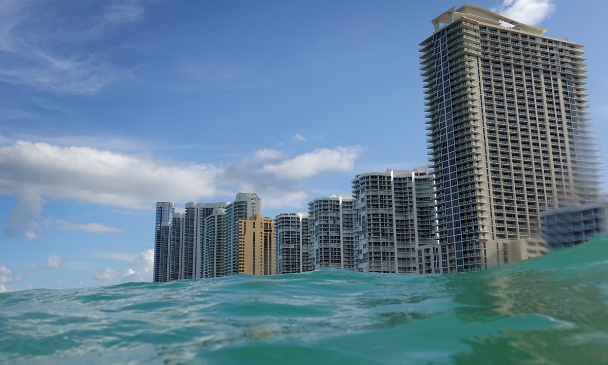Waves lap ashore near condo buildings on the day the United Nations released a report with a dire warning for humanity on Monday in Sunny Isles, Florida, the US. Photo: AFP