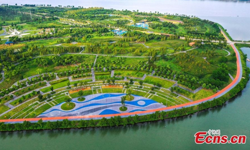 Yuliangzhou, an economic development zone in the central of Xiangyang City, is planted with lawn and green trees, Xiangyang, Hubei Province, August 10, 2021. (Photo/ Yang Dong) 

Xiangyang has launched several ecological restoration projects in recent years, which improves the ecosystem in Yuliangzhou. It is now served as a multifunction zone for residents to enjoy vacations, have short-term travel, or hold athletic activities.
