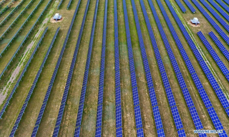 Aerial photo taken on Aug. 3, 2021 shows a photovoltaic power station in Tujing Village, Yunzhou District of Datong City, north China's Shanxi Province. The photovoltaic power station, built upon 1,851 mu (123.4 hectares) of saline-alkaline land, generates over 80 million KWH of power per year.(Phhoto: Xinhua)