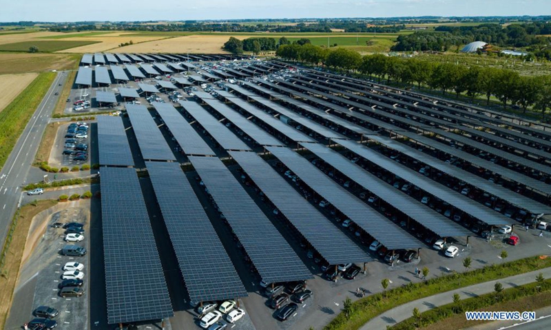 Aerial photo taken on Aug. 11, 2021 shows the photovoltaic parking lot of Pairi Daiza zoo in Brugelette, Belgium. The large photovoltaic parking lot with over 60,000 overhead solar panels can not only provide some 7,000 parking spots and also offer a total power of 20 megawatt peak (MWp) that is more than the zoo needs. (Xinhua/Zhang Cheng)

