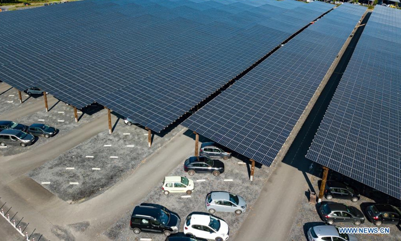 Aerial photo taken on Aug. 11, 2021 shows the photovoltaic parking lot of Pairi Daiza zoo in Brugelette, Belgium. The large photovoltaic parking lot with over 60,000 overhead solar panels can not only provide some 7,000 parking spots and also offer a total power of 20 megawatt peak (MWp) that is more than the zoo needs. (Xinhua/Zhang Cheng)