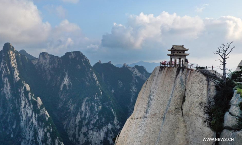 Aerial photo taken on Aug. 14, 2021 shows the mist-shrouded Mount Huashan in Weinan City, northwest China's Shaanxi Province. (Xinhua/Tao Ming)