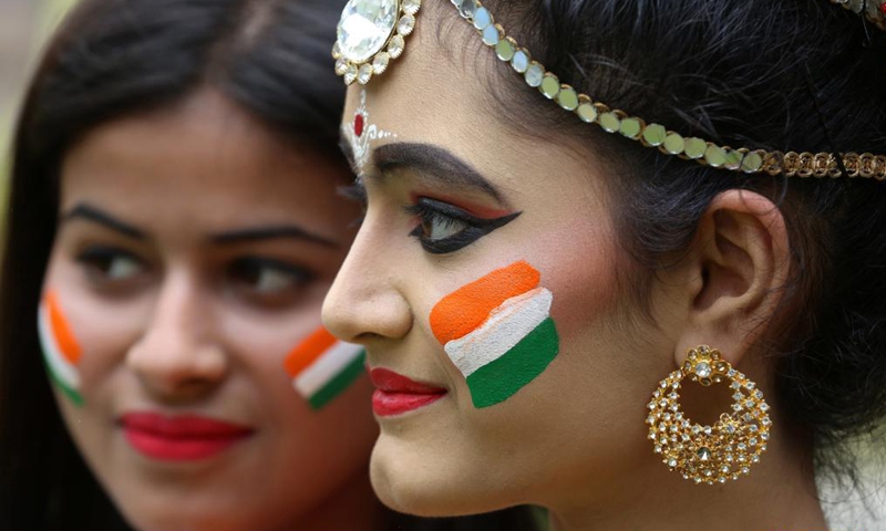 Indian women have their faces painted in the colors of the Indian national flag ahead of India's Independence Day in Bhopal, the capital city of India's Madhya Pradesh state, Aug. 14, 2021. The Independence Day of India falls on Aug. 15. (Str/Xinhua) 