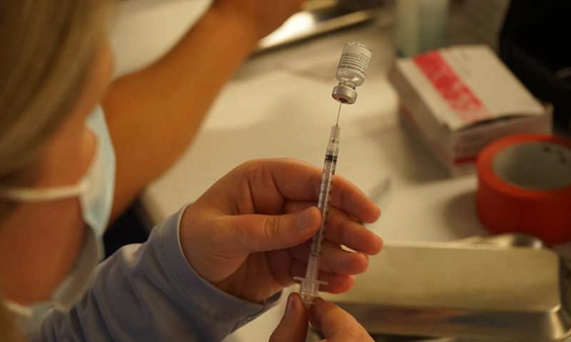 A medical worker prepares a dose of COVID-19 vaccine at the Universal Studios Hollywood in Los Angeles, California, the United States, June 18, 2021.Photo:Xinhua