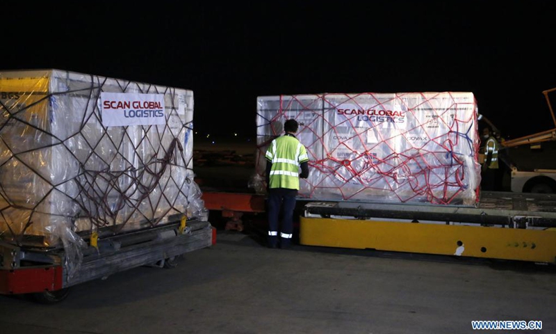 Staff members unload Chinese Sinopharm COVID-19 vaccines at Islamabad International Airport in Islamabad, capital of Pakistan, Aug. 11, 2021. The first batch of COVID-19 vaccine that China provided to the COVAX facility was officially handed over to Pakistan during a ceremony held here on Thursday. Early Wednesday morning, a batch of over 970,000 doses of Chinese Sinopharm COVID-19 vaccine arrived at Islamabad International Airport.Photo:Xinhua