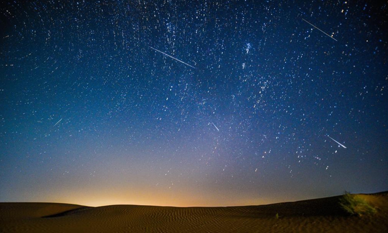 Photo taken on Aug. 13, 2021 shows the night sky during the Perseid Meteor Shower above an ecological demonstration zone of Engebei in Kubuqi Desert, north China's Inner Mongolia Autonomous Region.Photo:Xinhua