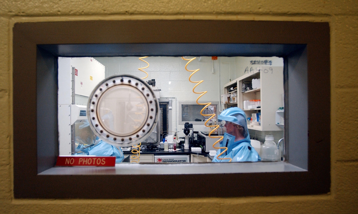 Personnel work inside the bio-level 4 lab research at the US Army Medical Research Institute of Infectious Diseases at Fort Detrick. Photo: AFP