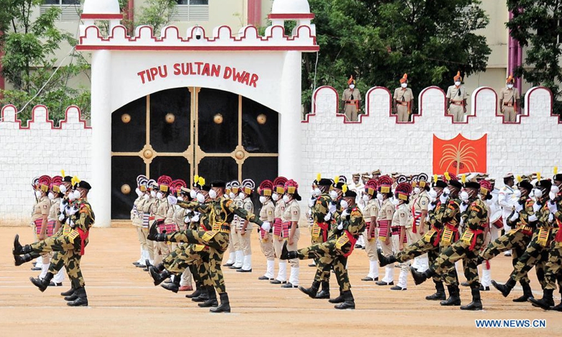 Indian Police and Border Security Force (BSF) personnel march during India's Independence Day celebrations at the Manek Shaw Parade Grounds, in Bangalore, India, Aug. 15, 2021. (Str/Xinhua)