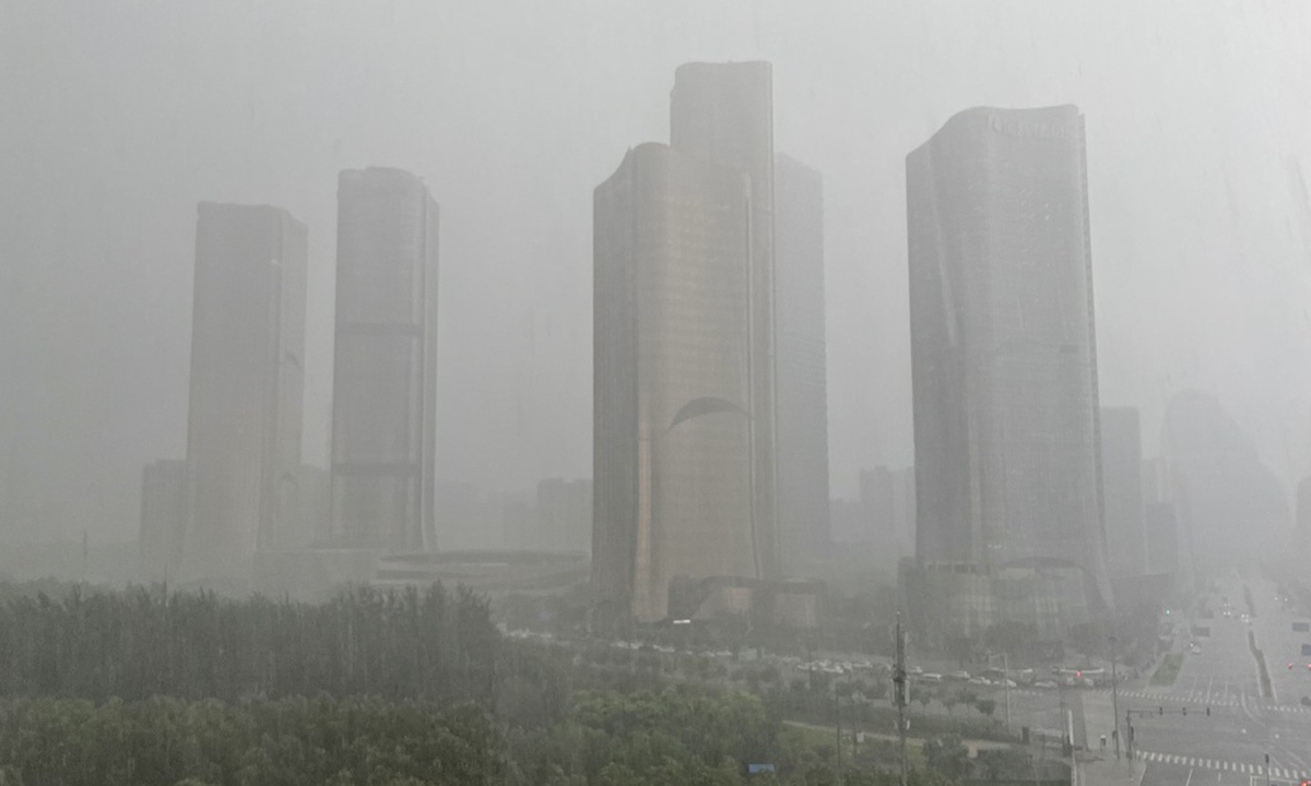 Buildings in Beijing blanketed in heavy rainfall Photo: VCG