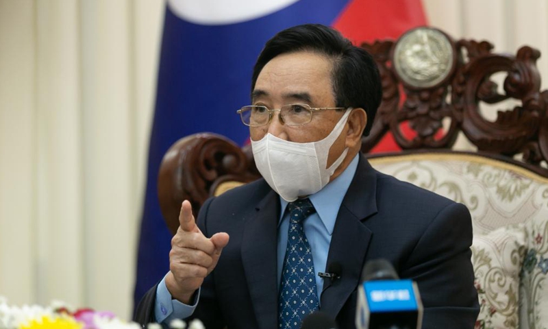 Lao Prime Minister Phankham Viphavanh receives an interview in Vientiane, Laos, Aug. 13, 2021. Political factors should not influence efforts to uncover the origins of COVID-19, said Phankham. Politicizing origin tracing is inhumane, and scientists from all countries must work together to find out why the disease occured in the first place, said the Lao Prime Minister when interviewed by Xinhua and other Chinese media here on Friday. (Photo by Kaikeo Saiyasane/Xinhua)