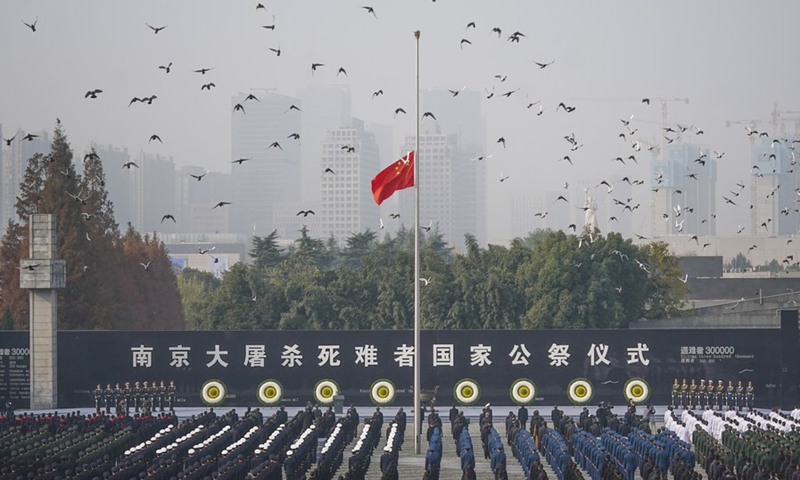 Photo taken on Dec. 13, 2020 shows the national memorial ceremony for the Nanjing Massacre victims at the Memorial Hall of the Victims of the Nanjing Massacre by Japanese Invaders in Nanjing, capital of east China's Jiangsu Province.(Photo: Xinhua)