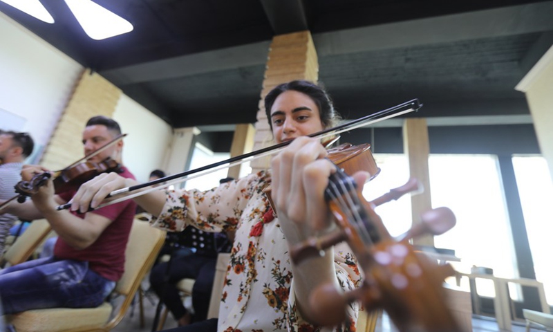 Orchestra members join to rehearse symphonic music in Mosul, Iraq on July 3, 2021.(Photo: Xinhua)