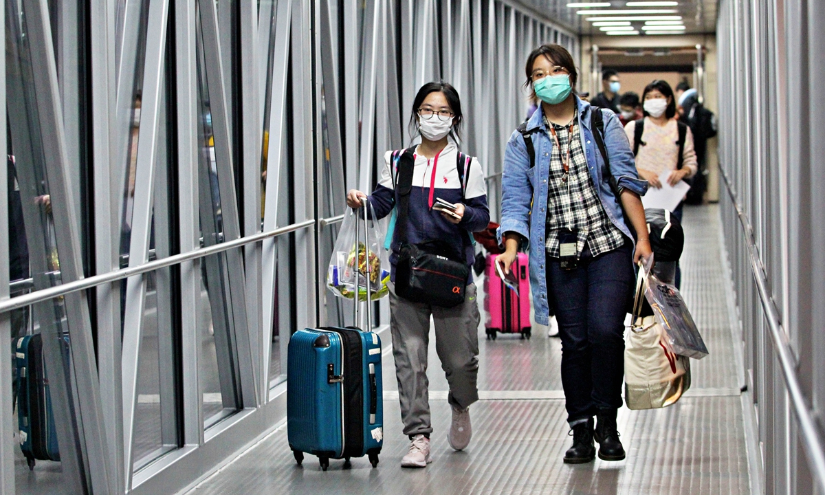 Chinese students board a charter flight from Southwest China's Chongqing to Manchester, UK in September 2020. Photo: cnsphoto