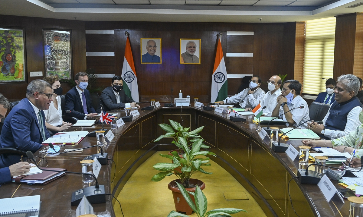 Indian Minister of Environment, Forest and Climate Change Bhupender Yadav (first right) meets with UN Climate Change Conference or COP26 President Alok Sharma (first left) in New Delhi, India on Wednesday during Sharma's three-day visit to India for discussions with ministers and leaders from the industry and civil society on collaboration on climate action. Photo: AFP