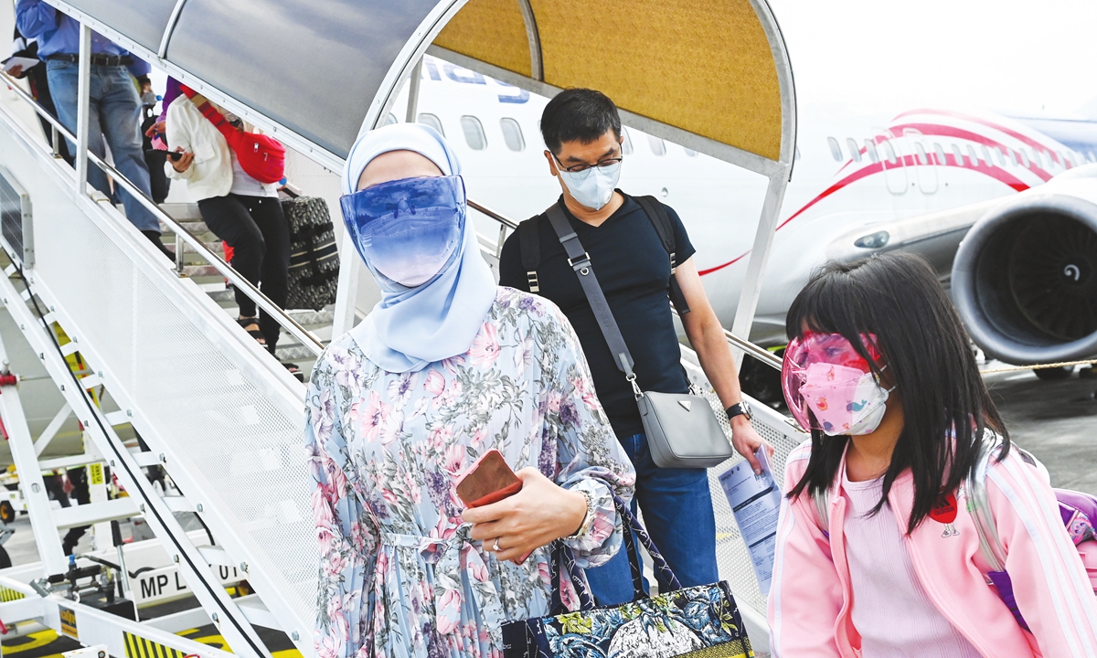 Passengers disembark from Malaysia Airlines aircraft Boeing 738 after landing in Langkawi from Kuala Lumpur International Airport on Thursday, as the holiday island reopened to domestic tourists following closures due to restrictions to halt the spread of the coronavirus. Photo: AFP
