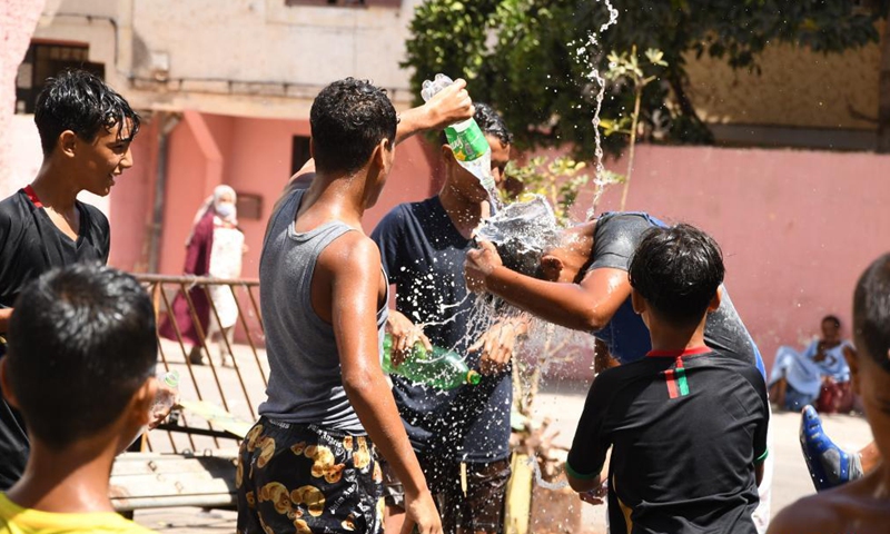 Children play with water on Ashura in Rabat, Morocco, on Aug. 19, 2021. Ashura takes place on the 10th day of Muharram, the first month in the Islamic lunar calendar.Photo:Xinhua