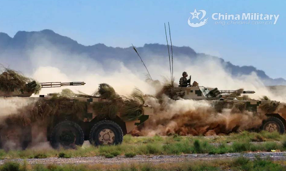 The armored assault group rumbles ahead to launch an assault against the forward position of mock terrorists in the China-Russia joint military exercise ZAPAD/INTERACTION-2021 at a training base of the PLA Army in Qingtongxia City of northwest China's Ningxia Hui Autonomous Region from August 9 to 13, 2021. Photo:China Military