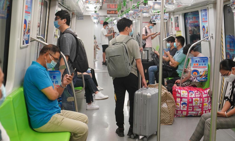 Passengers take subway line No. 3 in Nanjing, east China's Jiangsu Province, Aug. 20, 2021. Nanjing, which witnessed the country's latest resurgence of coronavirus cluster infections attributable to the Delta variant, cleared all medium- and high-risk areas for COVID-19 on Thursday.Photo:Xinhua