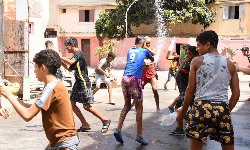 Children play with water on Ashura in Rabat, Morocco, on Aug. 19, 2021. Ashura takes place on the 10th day of Muharram, the first month in the Islamic lunar calendar.Photo:Xinhua