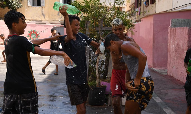 Children play with water on Ashura in Rabat, Morocco, on Aug. 19, 2021. Ashura takes place on the 10th day of Muharram, the first month in the Islamic lunar calendar.Photo:Xinhua