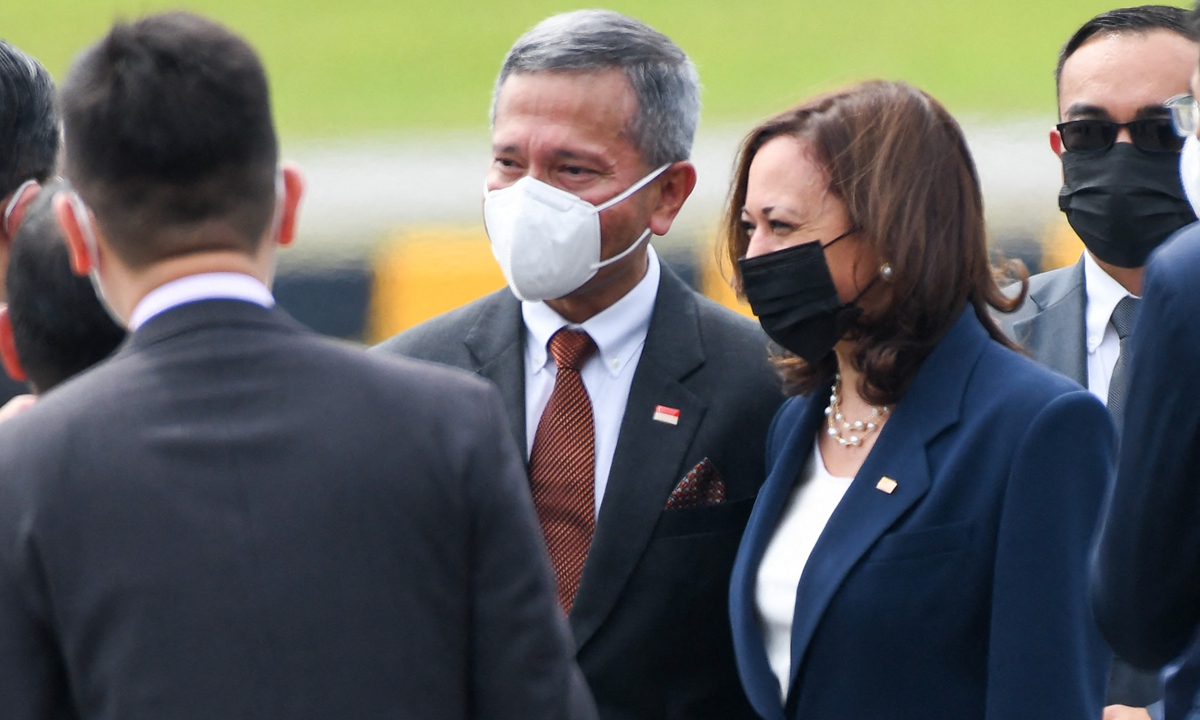 US Vice President Kamala Harris is greeted by Singapore Foreign Minister Vivian Balakrishnan (center) upon her arrival at Paya Lebar Base airport in Singapore on Sunday. Photo: AFP