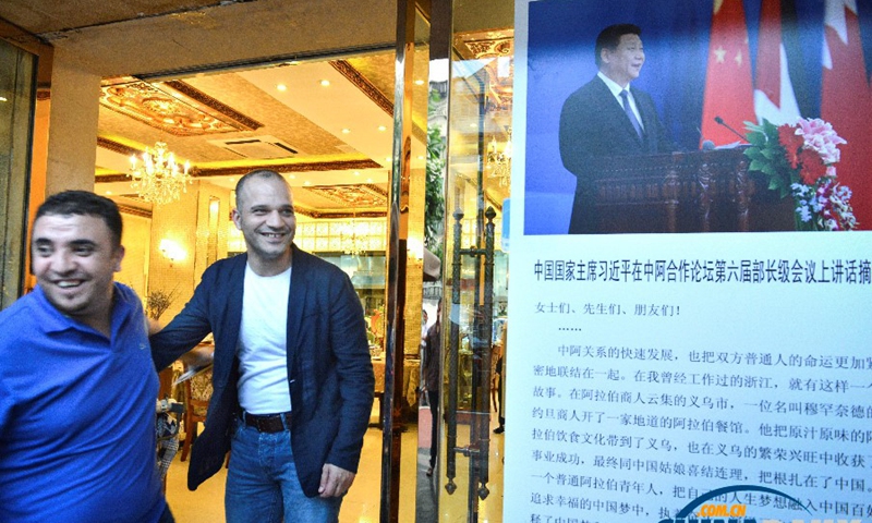 Muhamad greeting diners at the door to his Ward Restaurant. Since President Xi mentioned Muhamad and his restaurant in the speech at the China-Arab States Cooperation Forum, many people from China and abroad have come to dine here.