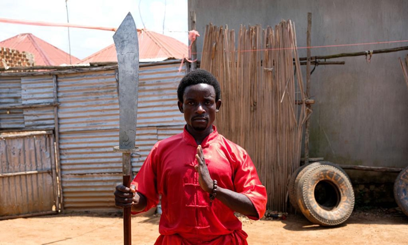 Manisuru Ssejjemba poses during his Chinese martial arts training at a makeshift training center behind his house in Katooke, north of Uganda's capital Kampala, Aug. 17, 2021.Photo: Xinhua