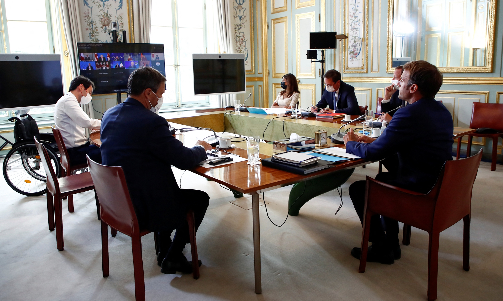 France's President Emmanuel Macron (right) takes part in a virtual G7 summit to discuss the crisis in Afghanistan at the Elysee Palace in Paris on Tuesday. Efforts to evacuate thousands of people from Afghanistan became increasingly urgent, as European nations said they would not be able to evacuate all at-risk Afghans before next week's deadline. Photo: AFP