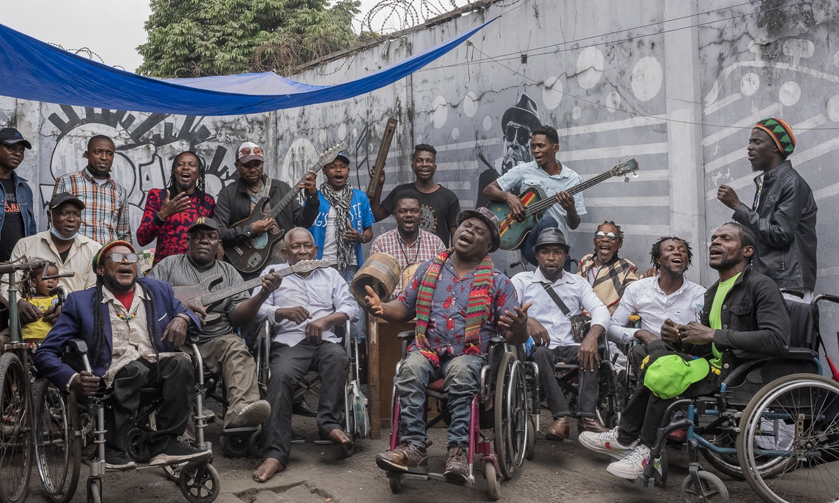 The members of Staff <em>Benda Bilili</em> pose for a photo during a rehearsal in the popular district of N'djili, Kinshasa, on August 11. Photo: AFP